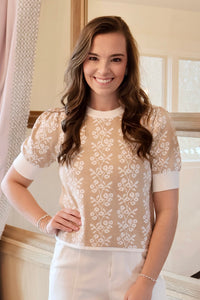 Welcome Spring with this lightweight feminine tan and white floral print short sleeve sweater.