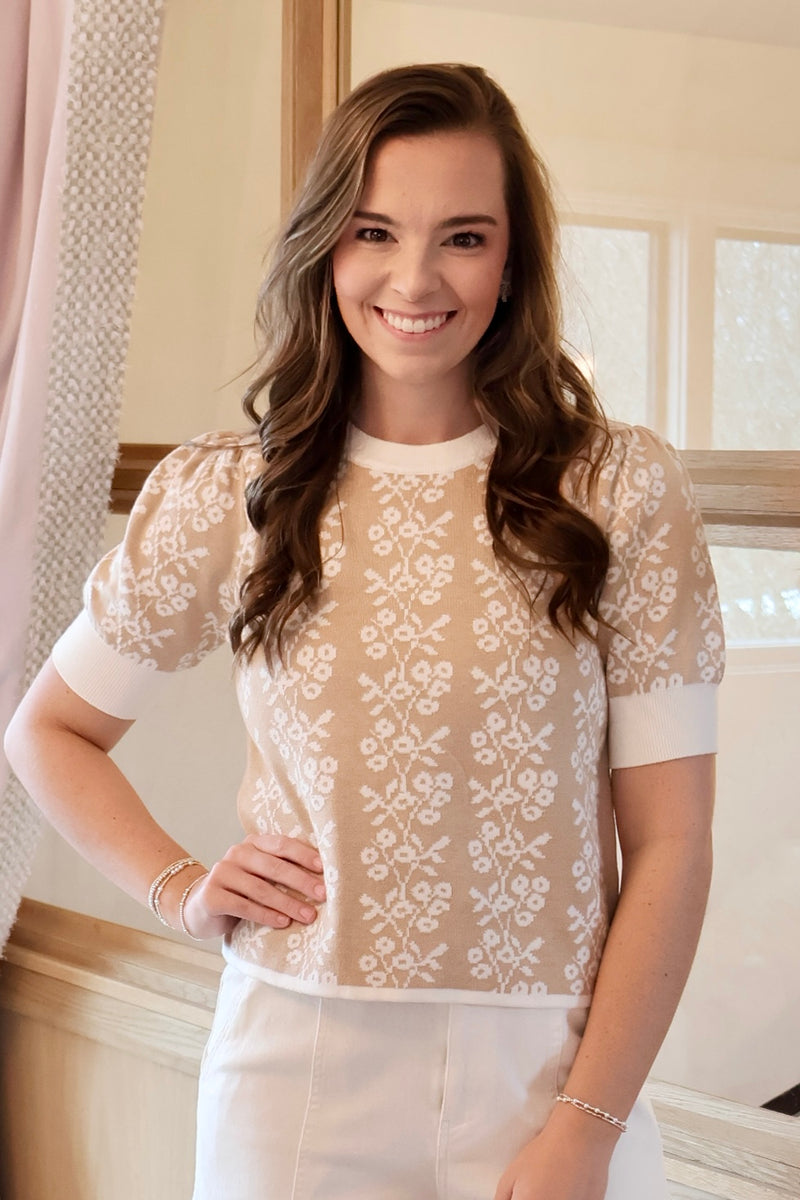 Welcome Spring with this lightweight feminine tan and white floral print short sleeve sweater.